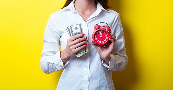 young woman with clock and money